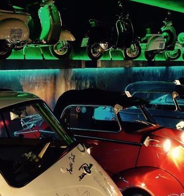 Collection of vintage cars and Vespas in the vintage car museum of the Oldtimer Hotel Watles, South Tyrol